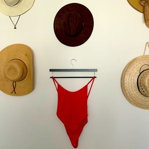 RED PLUNGE BODY SUIT